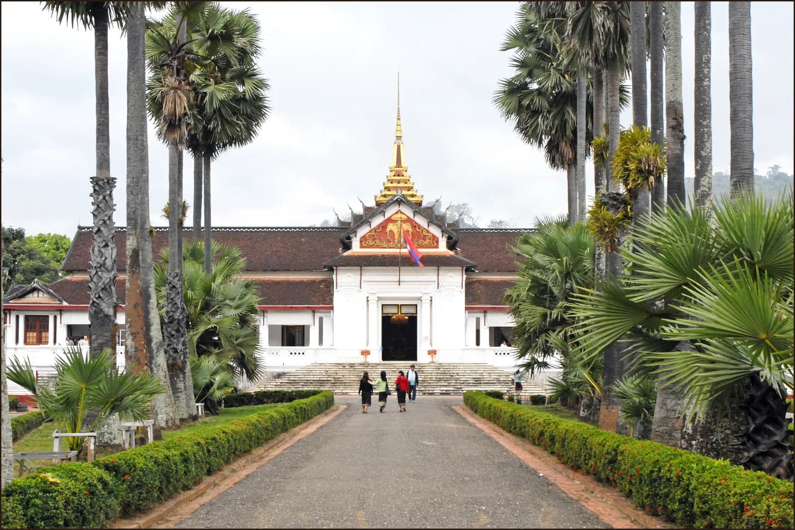 Palm-lined approach to the Royal Palace Museum in Luang Prabang